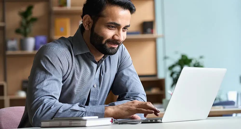 middle-eastern-male-submitting-a-claim-on-laptop